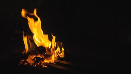 Forge fire in furnace. Blacksmith tempers a steel product in a stove. Smithy forging for hardening...