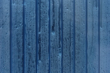 Fototapeta na wymiar Abstract plastic panel in blue with water drops. Partition. Wallpaper. Decoration
