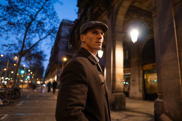 Old Fashion Man from the 1920s england walking along an old street of a historic city