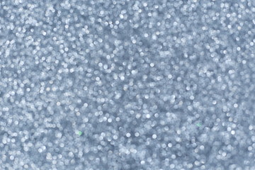 Defocused abstract gray lights background. Space. Wallpaper. Abstract glitter bokeh on black background