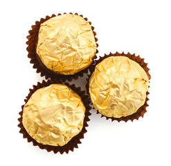 wrapped chocolate candy over white background
