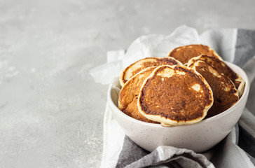 Homemade classic American pancakes in a ceramic bowl, copy space for text. Healthy breakfast.