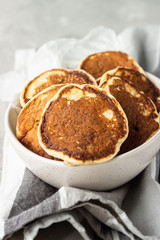 Homemade classic American pancakes in a ceramic bowl, copy space for text. Healthy breakfast.