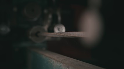 Forge workshop on table. Smithy manual production. Metal pipe craft electric twist wrought iron machine. The blacksmith makes iron products for manufacture of fireplaces, stoves.