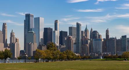 New York Skyline showing several prominent buildings and hotels under a blue sky.