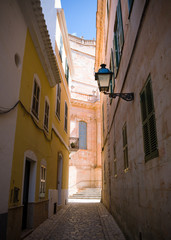 Obraz premium Street with colorful houses in old town of Ciutadella, Menorca, Balearic Islands, Spain, September, 2019