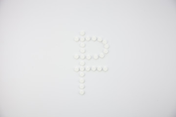 Ruble sign made of pills