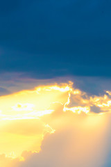 Fototapeta premium Dark stormy sky with the sun translucent