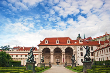 View of empty entrance to Wallenstein Palace, its statues and garden