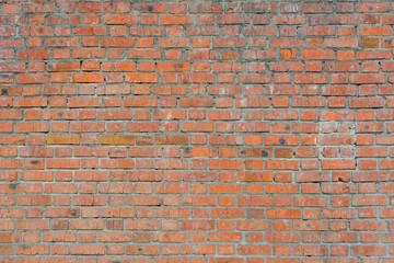 Old brick wall of red color, panorama of masonry. Texture background.