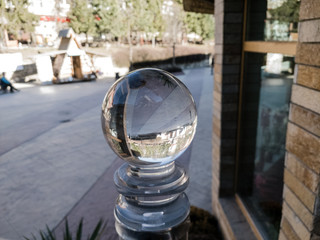Fototapeta na wymiar Glass ball in the city