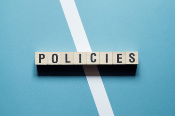 Policies word concept on cubes