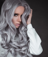 Portrait of gorgeous young girl with healthy long grey hair outdoor