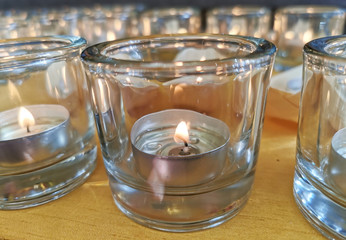 Candles in small little glasses during the vigil ceremony and prayer.