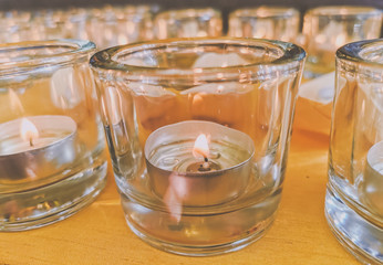 Candles in small little glasses during the vigil ceremony and prayer.