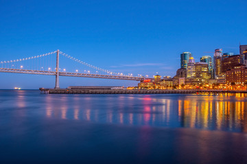 Fototapeta na wymiar San Francisco and Bay Bridge at Sunset