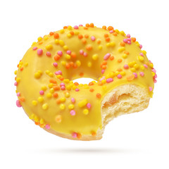 Yellow bitten donut isolated on white background.
