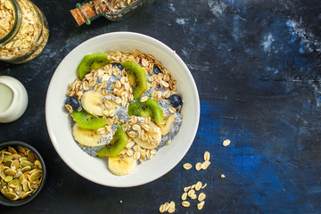 healthy food smoothie bowl, oatmeal, chia seeds and berries (breakfast dish or healthy snack) menu concept. background. top view. copy space
