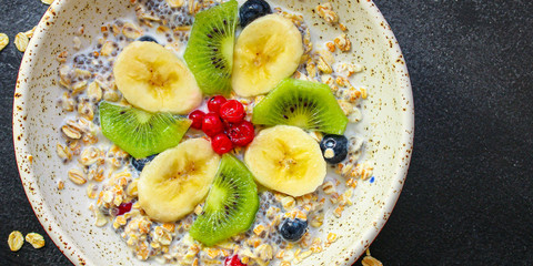 healthy food smoothie bowl, oatmeal, chia seeds and berries (breakfast dish or healthy snack) menu concept. background. top view. copy space