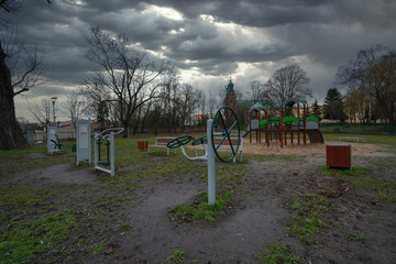 Outdoor gym equipment and children's playground in the city of Gniezno on Lake Jelonka, the first capital of Poland, Europe, Greater Poland