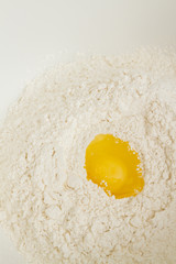 Cooking dough in a white plastic bowl at home