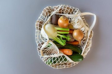 Close up of a white net with fresh organic vegetables