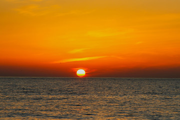 beautiful dawn on the sea, flight of ducks over the sea, ducks fly at dawn over the sea.