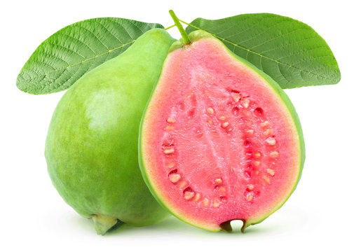 Isolated guava. One whole green guava fruit and a half with pink flesh on a branch with leaves isolated on white background with clipping path