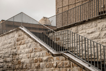 Staircase with metal railing and the dome of the astronomical observatory.