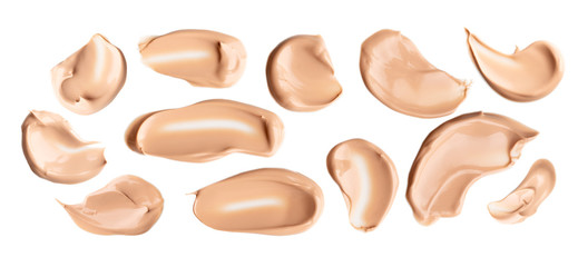Set of liquid gently beige smears of makeup creamy foundation isolated on white background....