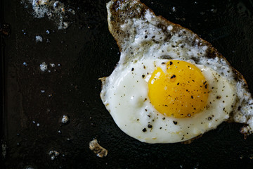 fried egg in a cast iron frying pan