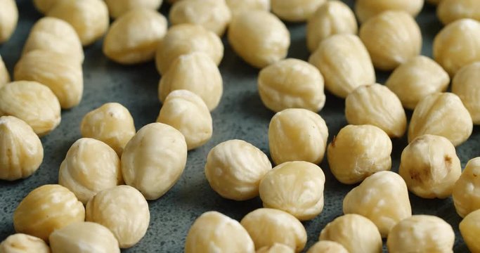 Nice yummy nuts rotating on dark kitchen surface. Close up of forest nuts. Healthy food. 4k.