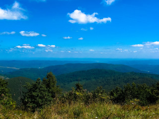 Fototapeta na wymiar Mountain on blue background. Summer landscape. Travel background. Scenic mountain landscape. Summer scenery. Summer vacation.