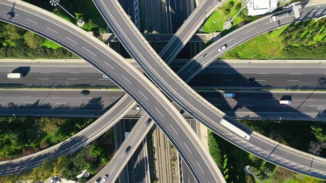 Aerial drone timelapse video of urban elevated toll road junction and interchange overpass in National road and Attiki odos of Attica, Athens, Greece