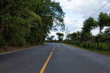 A Street with yellow line in the middle in El Salvador