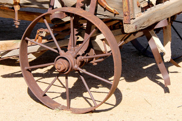 Fototapeta na wymiar rusted vintage old west wagon wheel