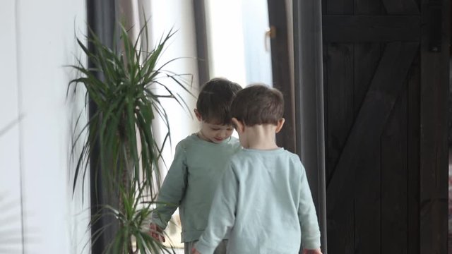 Little toddler boy play with a mirror at home