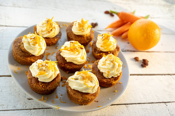 carrot cake cupcake bite size dessert snack homemade baked dessert cream orange peel decoration board composition cafe bistro