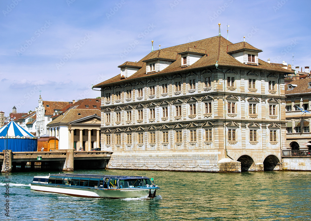 Wall mural excursion boat at old town hall in limmat river in zurich, switzerland