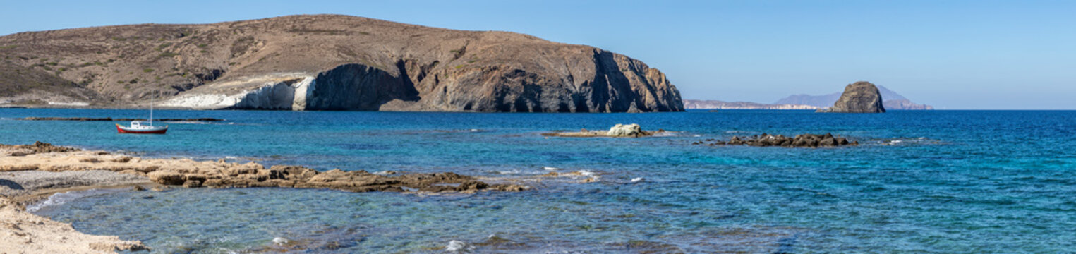 Mountains and boat in Pollonia beach