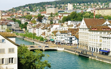 Fototapeta na wymiar Zurich, Switzerland - September 2, 2016: Bridge at Limmatquai in the city center of Zurich, Switzerland. People on the background. Seen from Lindenhof hill