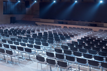 Naklejka premium Empty conference hall. Hall for business meeting. Interior of a congress hall. Empty conference room in the hotel ready for participants. Equipped conference hall. Indoor business conference