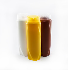 Shampoo bottles photographed on white background. Photographed in a studio setting.