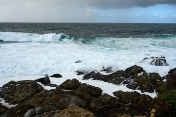Waves Crash onto Rocks Along Pacific Coast