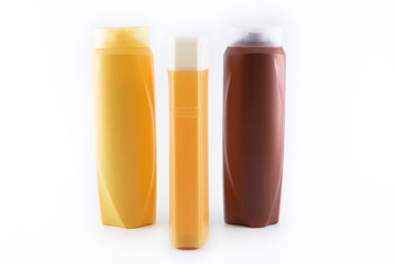 Shampoo bottles photographed on white background. Photographed in a studio setting.