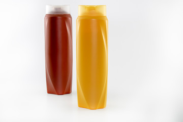 Shampoo bottles photographed on white background. Photographed in a studio setting.