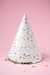 Birthday hat on a pink background