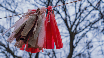 Strange pagan amulets on trees. Worship of pagan Gods and trees. Ancient pagan temple. Winter...