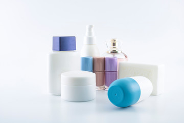 Set of plastic bottles of body care and beauty products.