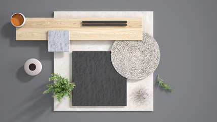 Minimal gray background with copy space, marble limestone and granite slabs, wooden plank, cutting board, rosemary and pepper and decors. Kitchen interior design concept, mood board